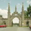 Taymouth Castle, South West entrance.
View of gate and gatehouse from West.
Digital image of D/21759/cn