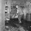 Interior 
View of retort house showing man working