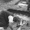 Digital copy of view of Brian Hope-Tayor excavating a grave, excavations by Brian Hope-Taylor 1948-49.
Digital image only