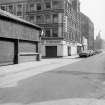 View from W showing SSW and part of WNW fronts with covered market in foreground