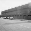 View from NW showing arched wall on Shettleston Road and forge building