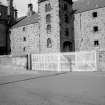 View from SE showing SSW and ESE fronts of castellated hoist block on E bay wing