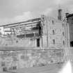 View from W showing W bay wing under demolition