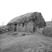 South West view of cruck-framed building; Lonbain.