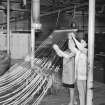 Interior view showing women working on fur hank-winding machine, John Street factory, Glasgow, in 1970.