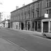View from SSW showing W front of warehouse with part of no 24 Oswald Street in foreground