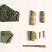 View small finds of glass, comb, bone pieces and coin for Old Windsor, Kingsbury, Berkshire, England.

