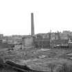 View from WNW showing Bonnington Mills chimney in middle background with Bonnington Road Lane Mill chimney in left background