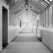 Interior -view of corridor behind main block from SW
