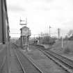 View from S showing SSE and WSW fronts of signal box with station buildings and footbridge in background