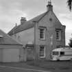 Kelso, The Knowes, Waverley Lodge. View of gable end of house showing portrait busts of Sir Walter Scott and his dog Maida.