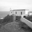 View from North-West of foghorn engine house, foghorn, fuel tank and perimeter wall.
Digital image of C 4266.