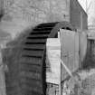 View from E showing waterwheel on NNE front