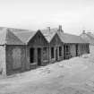 View from SE showing ENE and SSE fronts of store block with office block in background