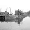 View from S showing crane and part of N lock gate at entrance to Albert Dock