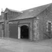 View from NW showing N and W fronts of stable block