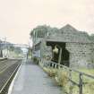 View from SW showing SW front of goods shed with footbridge in background