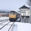 View from SSE showing SSE front of signal box with Stranraer train approaching station