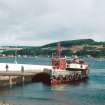 View from SE showing ESE front of pier with 'Eilean Dubh' moored alongside