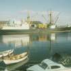 View from SE showing steamer moored on NW side of E harbour