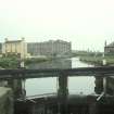 View from ENE showing S lock gate with inn in left background and terraced houses in right background