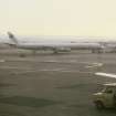 View from SSE showing DC8 aircraft on tarmac outside terminal