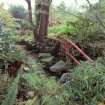 View of japanese water garden with red "bridge" and stepping stones
Digital image of E 31016 CN