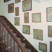 Interior, view of staircase with display of samplers
Digital image of E 30915 CN