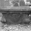 View of table tomb with skull and bones behind pleated drape held by lion heads on base, St Mary's Church burial ground, Banff.