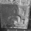 Detail of tablet to George Baird dated 1771. Symbols visible include masons' tools above skull and hour-glass
Digital image of B 42929/23