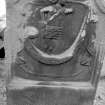 Detail of standing tombstone dedicated to Alex Reid dated 1764, in the churchyard of St Mary's Church, Banff. Symbols visible include angel blowing trumpet out of which banner is flowing.
