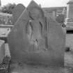 General view of gravestone commemorating 'J.E', with full figure portait of a gentleman.
Digital image of B 42930/33