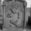 Peebles, Old Town, Old St. Andrew's Church, cemetery.
General view of the headstone of Thos. Gibson, dies 1763. Twisted pilasters, and pointed top, with central winged soul, skull, hourglass, crossed bones. 
Insc: 'Fugit Hora' and 'Memento Mori'.
Digital image of B 4146/11