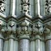Detail showing gargoyles on colonette capitals to right hand side of main entrance in SW elevation.