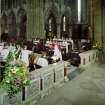 Interior.
View showing entrance to choir with director of music conducting choristers.