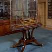 Interior.
Principal floor, library, view of ship model 'Hibernia' inside glass case.