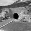 View of Power Station Access Tunnel Portal during construction work.
Copy of negative, Strathfarrar, Box 1139/2, Contract 101, Plate 324. 
