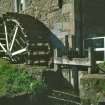 View of water wheel and sluice from NE.
Copy of 35 mm colour transparency.