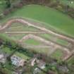 NW oblique aerial view of the excavations at Dullatur Roman Camps, Antonine Wall.