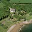 Oblique aerial view of Dunrobin Castle, walled garden and formal gardens, taken from the SW.