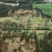 Oblique aerial view of Rough Castle, the Antonine Wall and a field system, from the N.