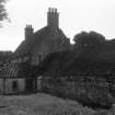 View of farmhouse and steading from NW.