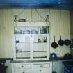 Scanned image of colour slide.
Mingulay, view of school house interior - kitchen cupboard.