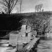 Showing part of weir and intake works.