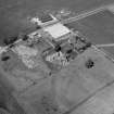 Oblique aerial view centred on Powrie Castle.