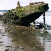 In the 1950s the Admiralty deliberately  beached this barge (NT07NE 8003) on the mud flats to the east of Blackness Castle to from a target. This image shows the  starboard bow.