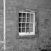 Scanned image of detail of window on East front.