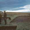 View of Hope-Taylor and two other people on site.