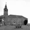 View from south showing spire and plate tracery.