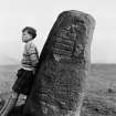Digital copy of photograph of symbol stone, with kilted boy (5 feet 8 inches high) as scale.